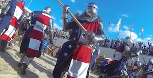 Medieval combat: armored men cross swords